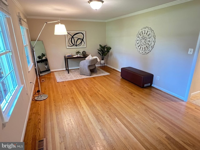 1027 Hart Rd, Baltimore, MD 21286 - sitting room featuring light wood-style floors, ornamental molding, healthy amount of natural light, and baseboards
