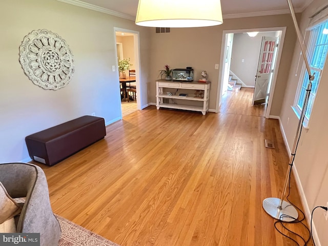 1027 Hart Rd, Baltimore, MD 21286 - living room with wood finished floors, stairway, ornamental molding, and baseboards