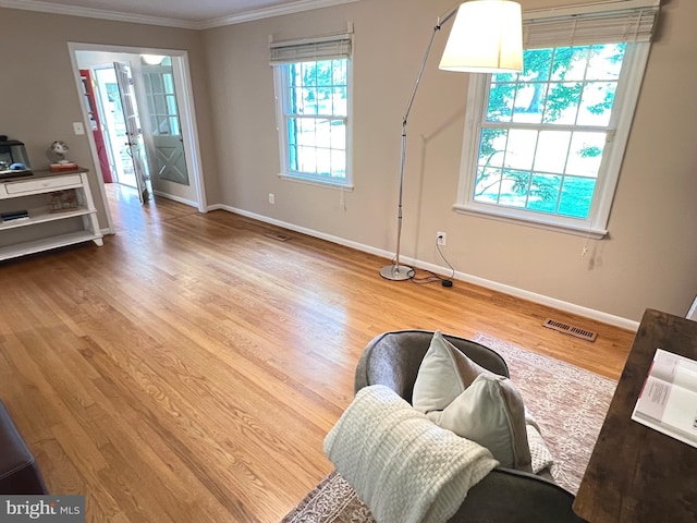 1027 Hart Rd, Baltimore, MD 21286 - living area featuring ornamental molding, baseboards, and wood finished floors