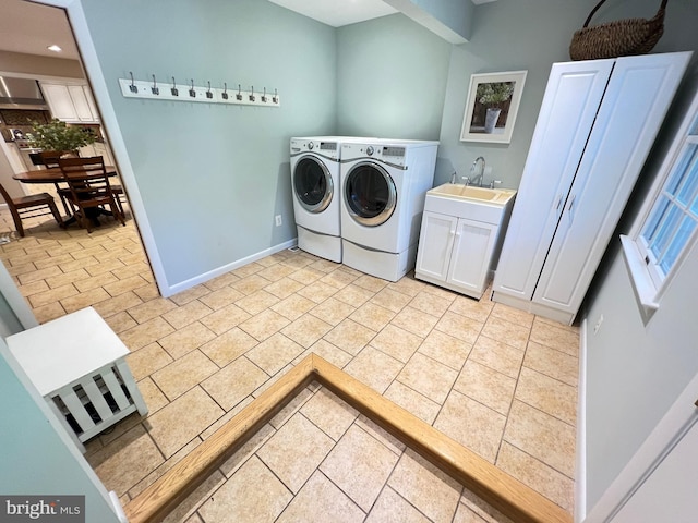1027 Hart Rd, Baltimore, MD 21286 - laundry area with washer and dryer, light tile patterned floors, baseboards, cabinet space, and recessed lighting