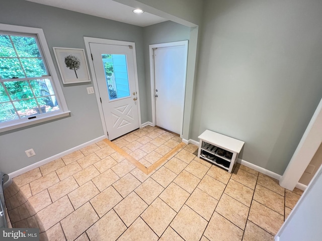 1027 Hart Rd, Baltimore, MD 21286 - foyer entrance with baseboards, light tile patterned floors, and recessed lighting
