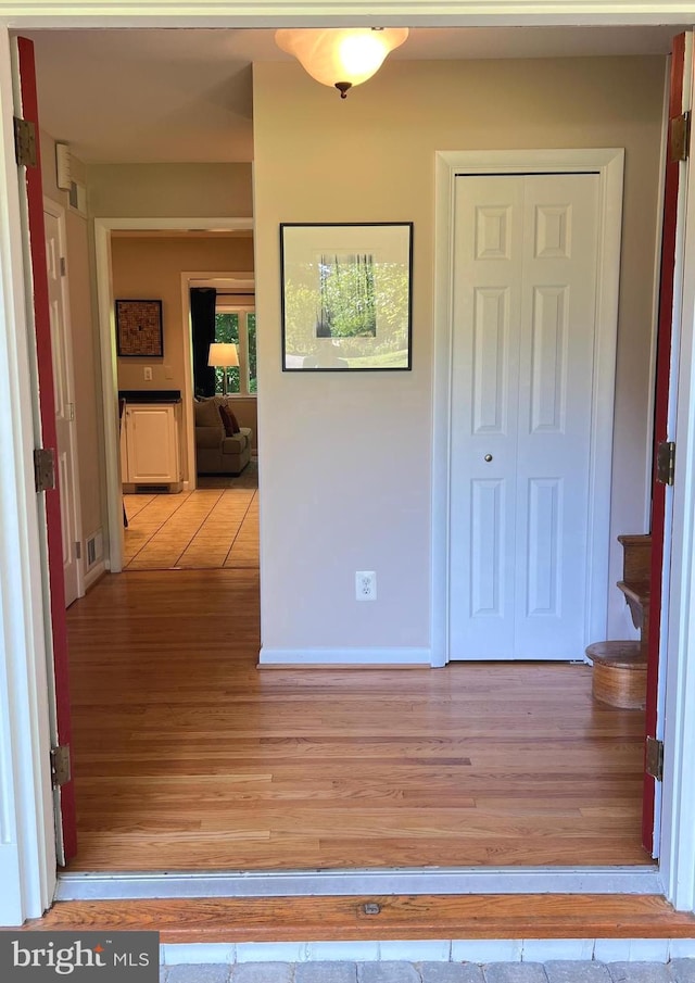 1027 Hart Rd, Baltimore, MD 21286 - hallway featuring light wood finished floors and baseboards