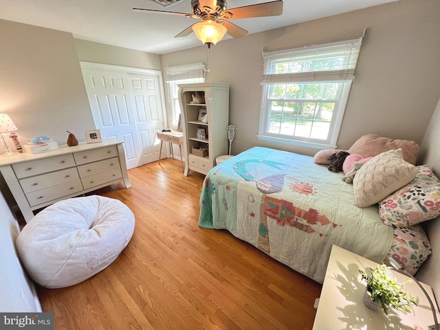 1027 Hart Rd, Baltimore, MD 21286 - bedroom featuring light wood-style floors, a ceiling fan, and a closet