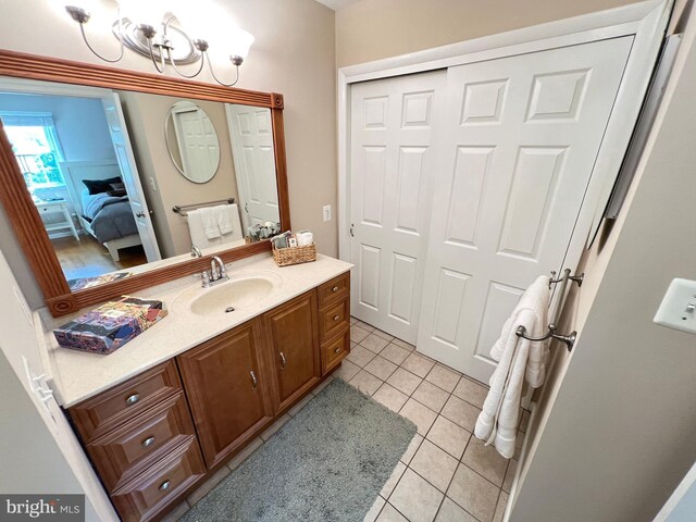 1027 Hart Rd, Baltimore, MD 21286 - bathroom with ensuite bath, vanity, tile patterned floors, and a chandelier