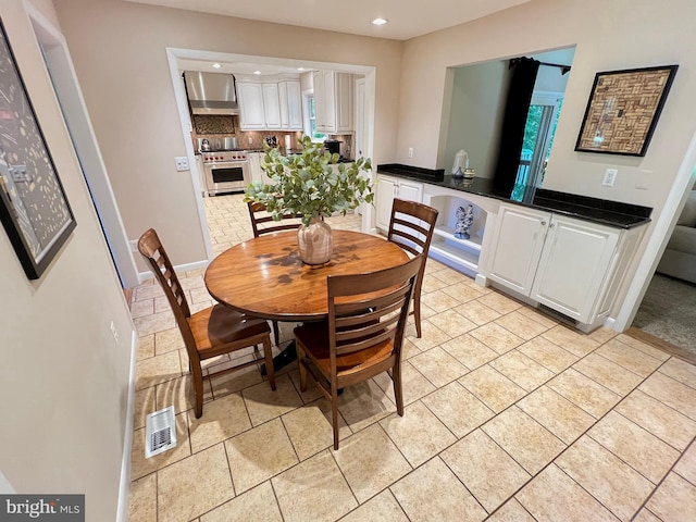 1027 Hart Rd, Baltimore, MD 21286 - dining room with recessed lighting and light tile patterned floors