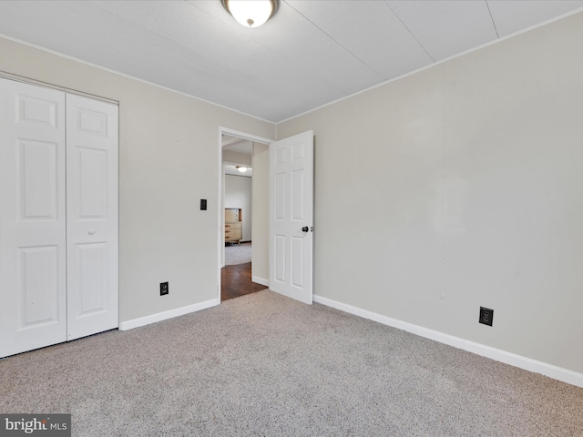 12 Dewey St, Schuylkill Haven, PA 17972 - unfurnished bedroom featuring carpet floors, baseboards, a closet, and crown molding