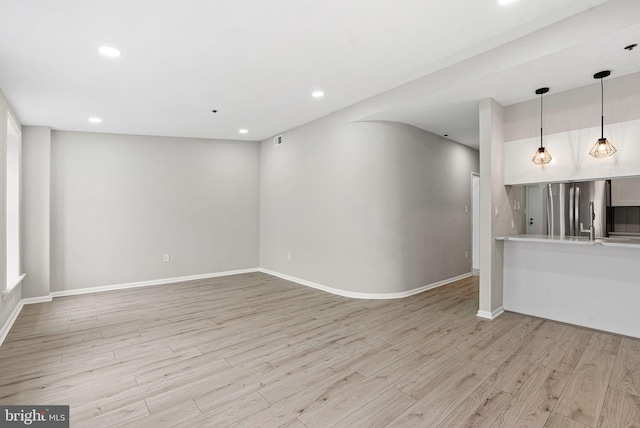 234 N 3rd St Unit 401, Philadelphia, PA 19106 - unfurnished living room featuring light wood-style floors, recessed lighting, and baseboards
