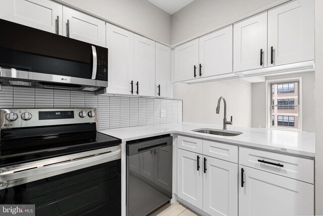 234 N 3rd St Unit 401, Philadelphia, PA 19106 - kitchen with appliances with stainless steel finishes, a sink, and white cabinets
