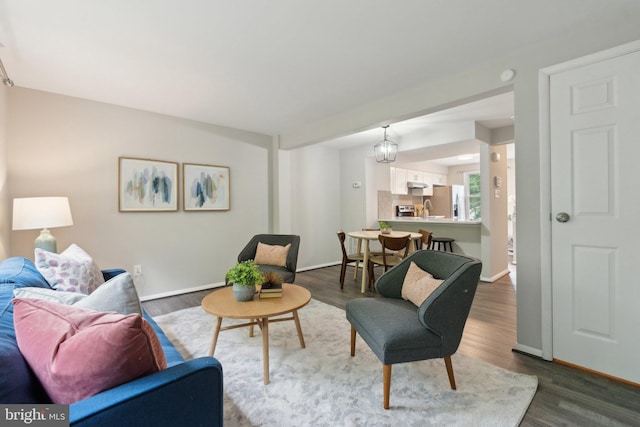 6842 Heatherway Ct, Alexandria, VA 22315 - living room featuring baseboards and dark wood finished floors