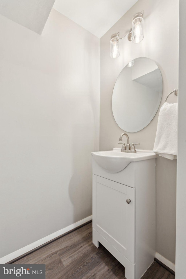6842 Heatherway Ct, Alexandria, VA 22315 - bathroom with vanity, wood finished floors, and baseboards