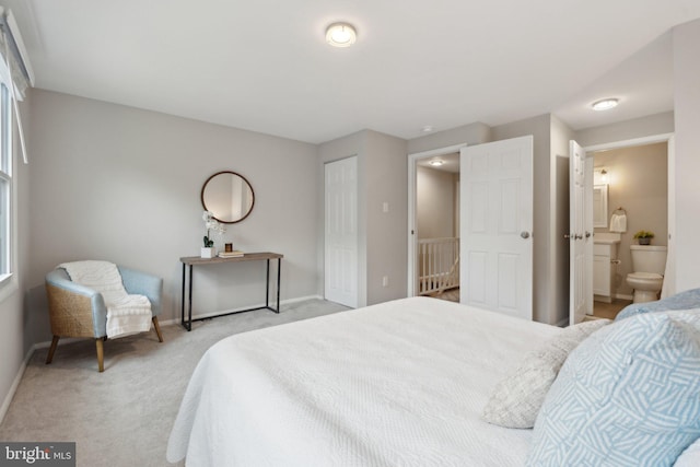 6842 Heatherway Ct, Alexandria, VA 22315 - bedroom with light carpet, baseboards, and ensuite bathroom