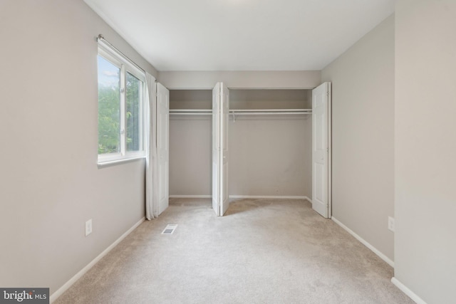 6842 Heatherway Ct, Alexandria, VA 22315 - unfurnished bedroom featuring multiple closets, carpet flooring, and baseboards