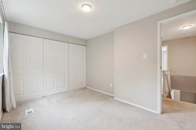 6842 Heatherway Ct, Alexandria, VA 22315 - unfurnished bedroom with carpet flooring, a closet, and baseboards
