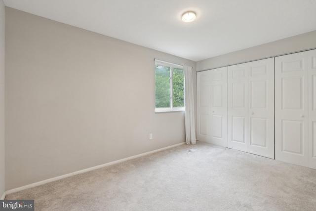 6842 Heatherway Ct, Alexandria, VA 22315 - unfurnished bedroom with carpet, baseboards, and a closet