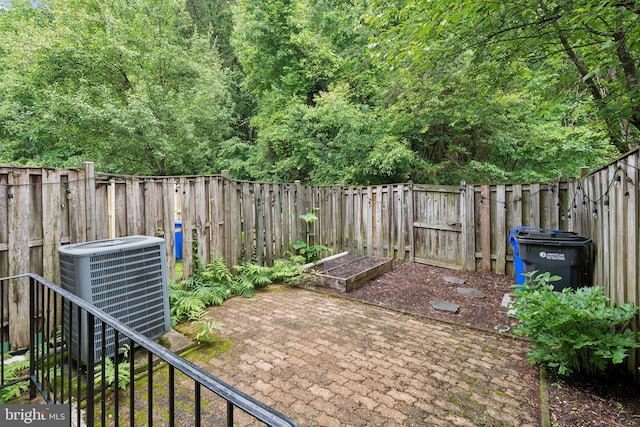 6842 Heatherway Ct, Alexandria, VA 22315 - fenced backyard featuring central AC unit, a patio, and a gate