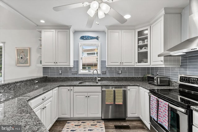 537 Candlelight Ln, Bethany Beach, DE 19930 - kitchen featuring appliances with stainless steel finishes, wall chimney exhaust hood, a sink, white cabinets, and dark wood-type flooring