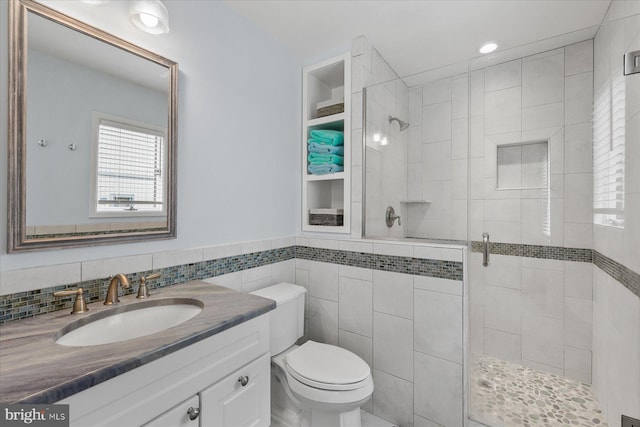537 Candlelight Ln, Bethany Beach, DE 19930 - full bathroom with a shower stall, toilet, vanity, and tile walls