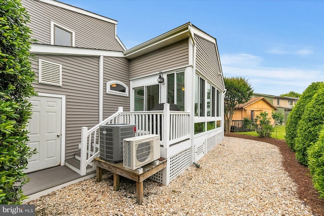 537 Candlelight Ln, Bethany Beach, DE 19930 - back of house with central AC unit and a cooling unit