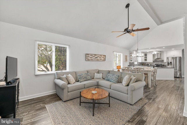 537 Candlelight Ln, Bethany Beach, DE 19930 - living area with ceiling fan, wood finished floors, healthy amount of natural light, baseboards, and high vaulted ceiling