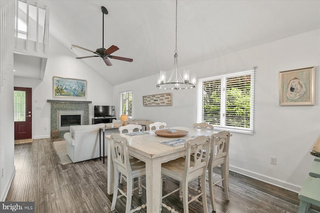 537 Candlelight Ln, Bethany Beach, DE 19930 - dining area with high vaulted ceiling, a glass covered fireplace, baseboards, dark wood-style flooring, and a chandelier