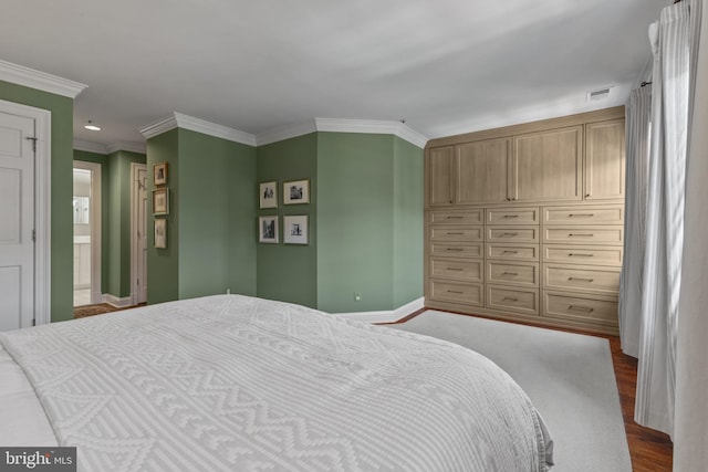 54 Wolfe St, Alexandria, VA 22314 - bedroom with baseboards, crown molding, and dark wood-style flooring