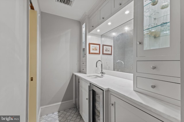 54 Wolfe St, Alexandria, VA 22314 - full bath with beverage cooler, vanity, and baseboards