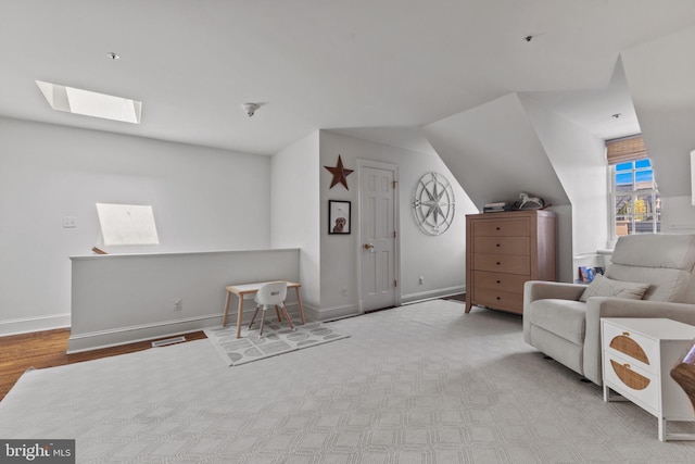 54 Wolfe St, Alexandria, VA 22314 - sitting room with a skylight, baseboards, and vaulted ceiling