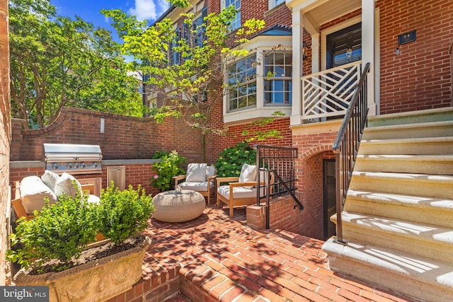 54 Wolfe St, Alexandria, VA 22314 - view of patio with an outdoor kitchen and stairway