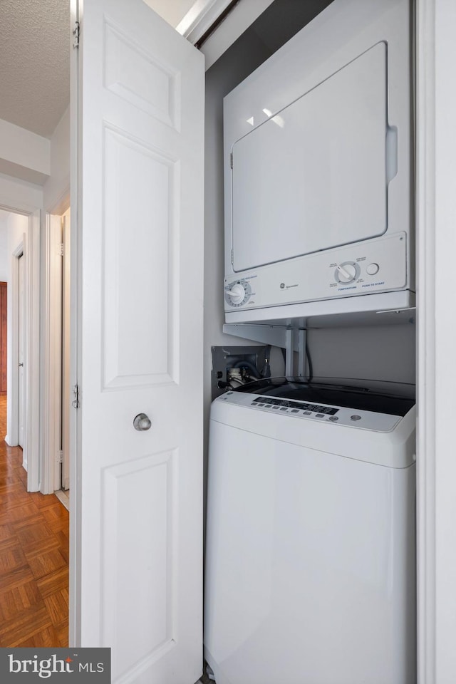 4801 Fairmont Ave Unit 804, Bethesda, MD 20814 - laundry room with stacked washer and clothes dryer