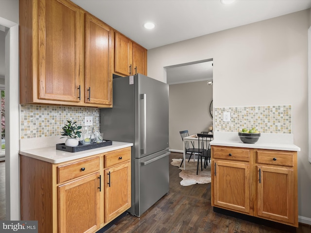 13214 Holdridge Rd, Silver Spring, MD 20906 - kitchen with freestanding refrigerator, backsplash, dark wood finished floors, light countertops, and recessed lighting