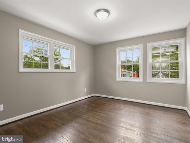 13214 Holdridge Rd, Silver Spring, MD 20906 - unfurnished room featuring healthy amount of natural light, dark wood-style flooring, and baseboards