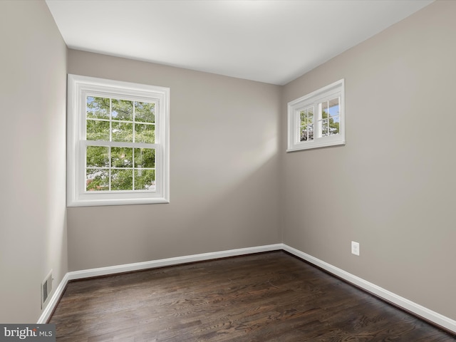 13214 Holdridge Rd, Silver Spring, MD 20906 - unfurnished room with plenty of natural light, baseboards, and dark wood-style floors