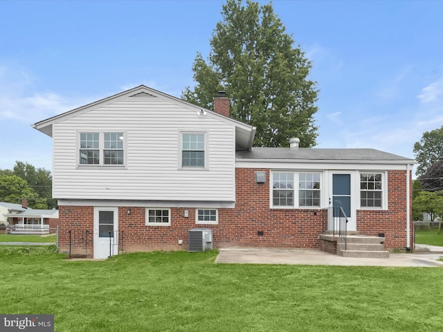 13214 Holdridge Rd, Silver Spring, MD 20906 - rear view of property with brick siding, central air condition unit, a chimney, and a patio