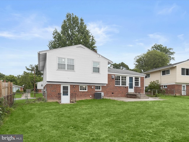 13214 Holdridge Rd, Silver Spring, MD 20906 - back of house featuring central air condition unit, a patio, and brick siding
