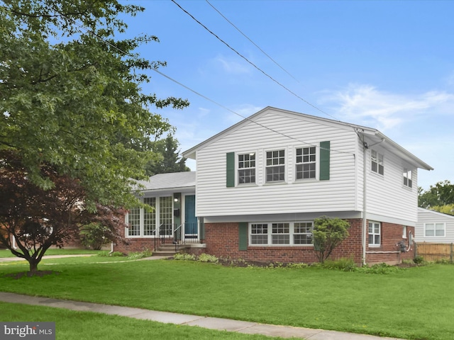 13214 Holdridge Rd, Silver Spring, MD 20906 - split level home featuring brick siding and a front lawn