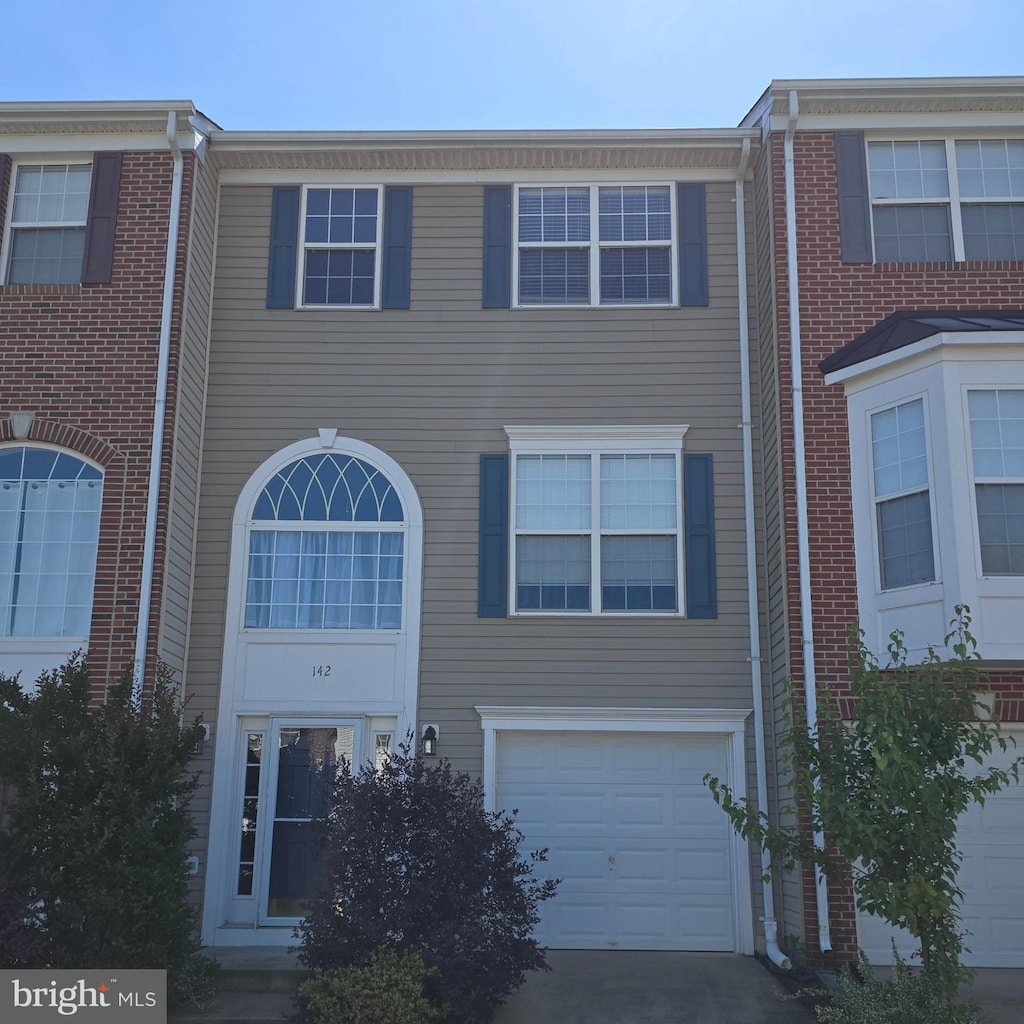 142 Arla Ct, Stafford, VA 22554 - townhome / multi-family property with a garage and driveway