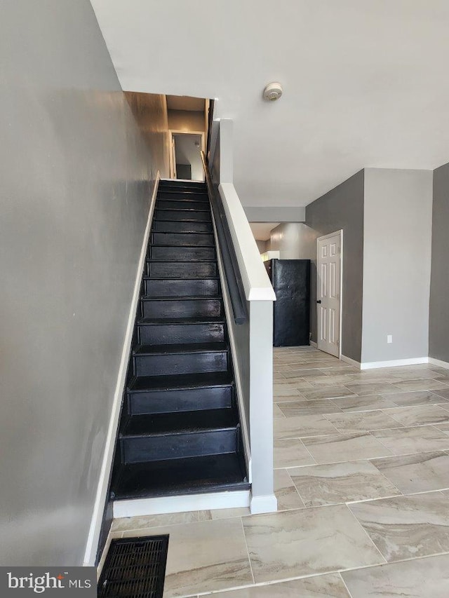 713 N Payson St, Baltimore, MD 21217 - staircase with baseboards