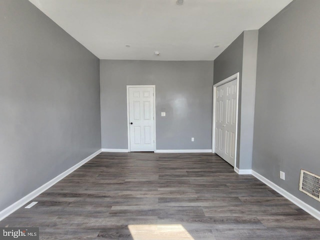713 N Payson St, Baltimore, MD 21217 - unfurnished bedroom featuring baseboards, a closet, and wood finished floors