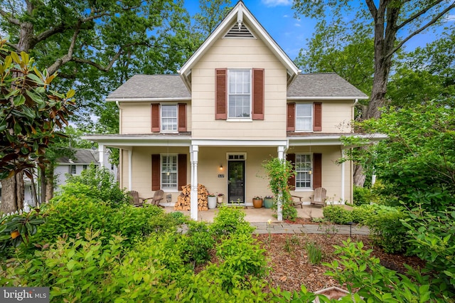 1602 S Rolling Rd, Halethorpe, MD 21227 - view of front of property with roof with shingles and a porch
