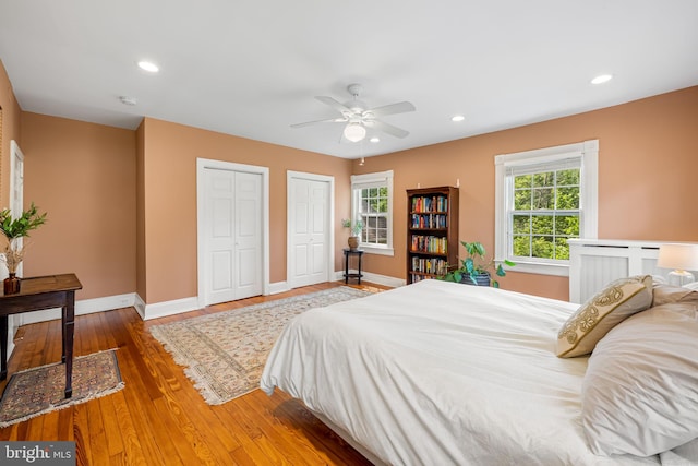1602 S Rolling Rd, Halethorpe, MD 21227 - bedroom with baseboards, two closets, wood finished floors, recessed lighting, and ceiling fan