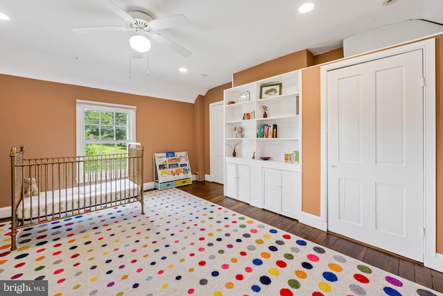 1602 S Rolling Rd, Halethorpe, MD 21227 - bedroom featuring baseboards, wood finished floors, recessed lighting, vaulted ceiling, and a crib