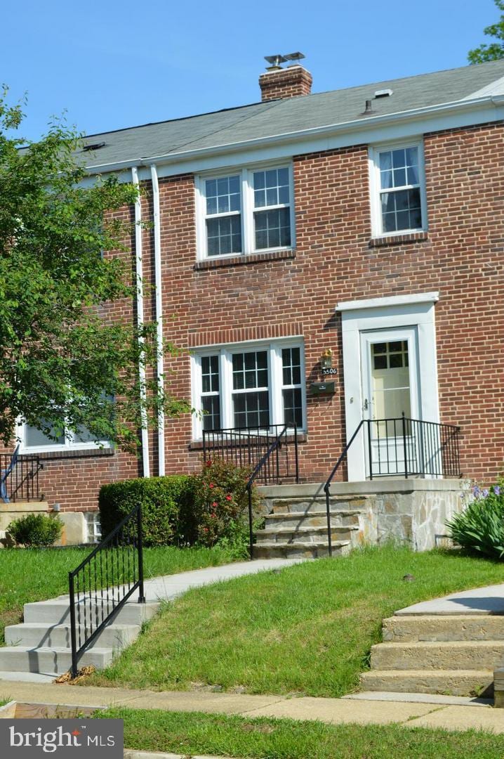 5506 N Medwick Garth, Baltimore, MD 21228 - view of front of house featuring brick siding and a chimney