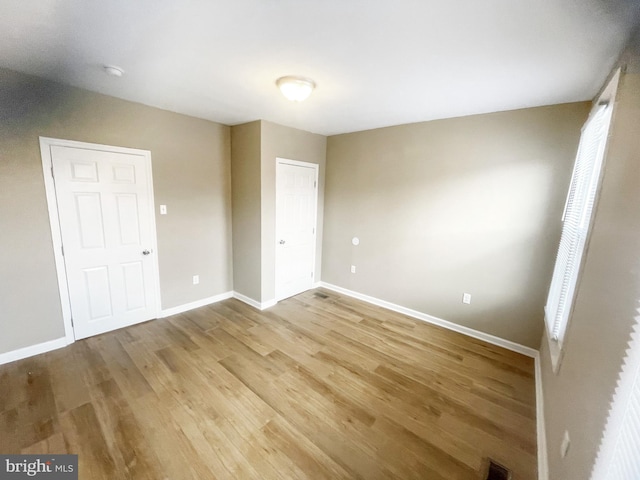 978 N 45th St, Philadelphia, PA 19104 - unfurnished bedroom with wood finished floors and baseboards