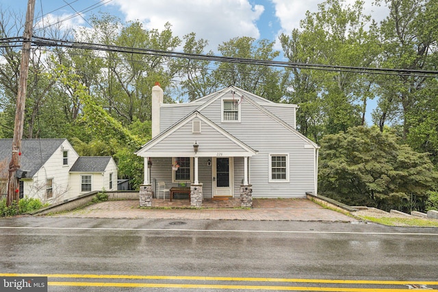 228 Balligomingo Rd, Conshohocken, PA 19428 - view of front of home with covered porch and a chimney
