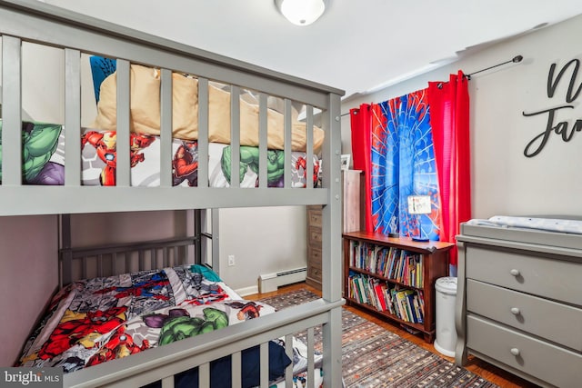 228 Balligomingo Rd, Conshohocken, PA 19428 - bedroom with a baseboard radiator and wood finished floors