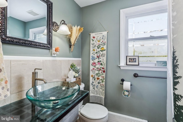 228 Balligomingo Rd, Conshohocken, PA 19428 - bathroom with toilet, a sink, and baseboard heating