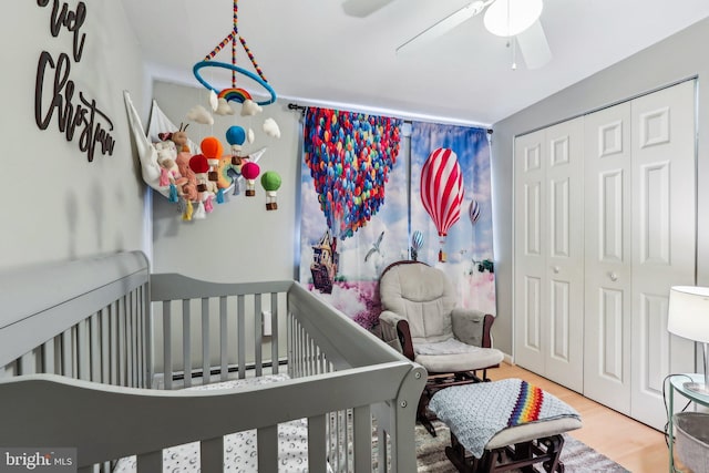 228 Balligomingo Rd, Conshohocken, PA 19428 - bedroom featuring a crib, a closet, wood finished floors, and a ceiling fan