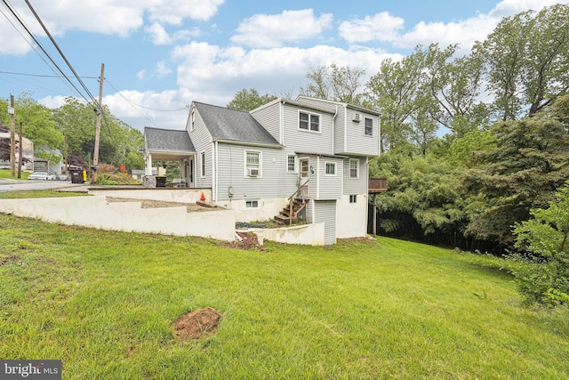 228 Balligomingo Rd, Conshohocken, PA 19428 - back of house with a lawn, stairway, a shingled roof, and driveway
