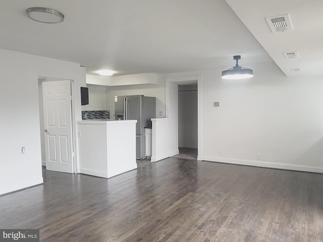 5851 Quantrell Ave Unit T4, Alexandria, VA 22312 - unfurnished living room featuring dark wood-type flooring and baseboards
