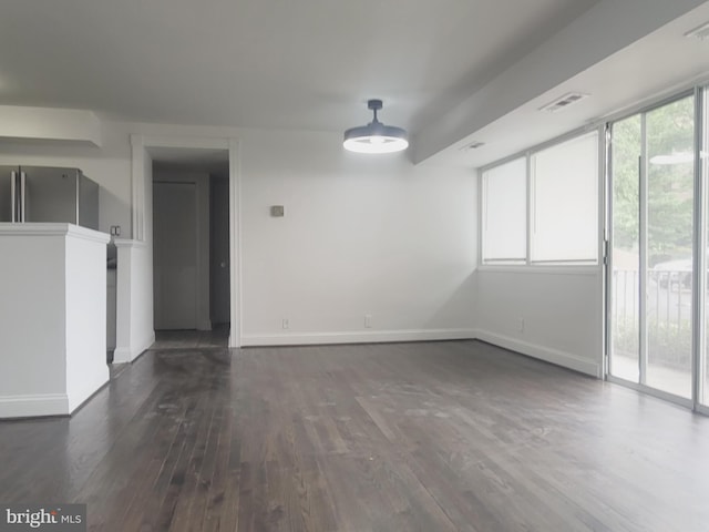 5851 Quantrell Ave Unit T4, Alexandria, VA 22312 - empty room featuring dark wood-style flooring and baseboards